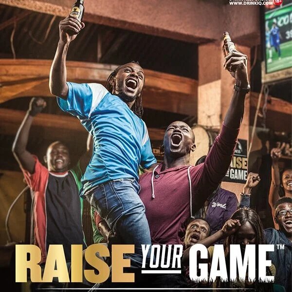 Guinness Raise Your Game: fans celebrating in a bar, arms up, phones in hand.